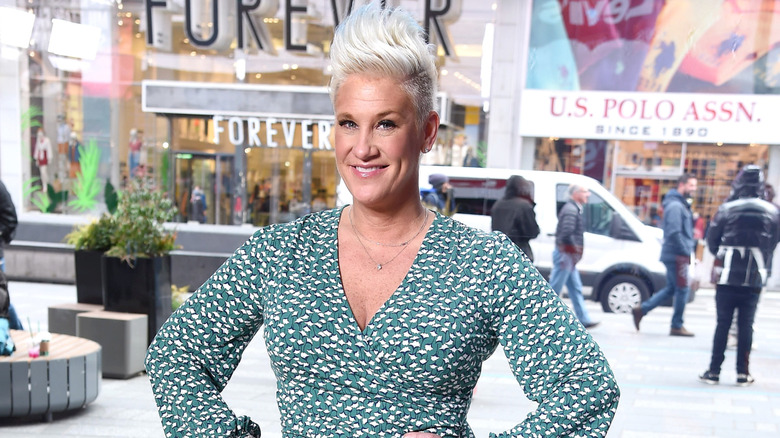 The late chef Anne Burrell smiling in Times Square