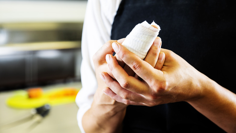 Chef with an injured hand in a bandage