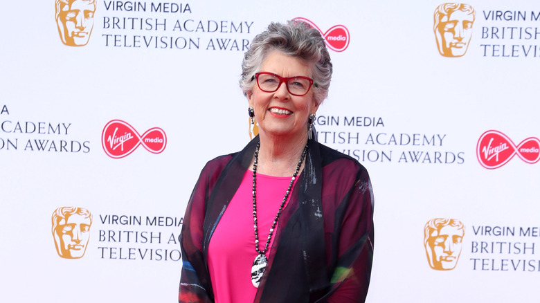 Prue Leith smiling at a red carpet event