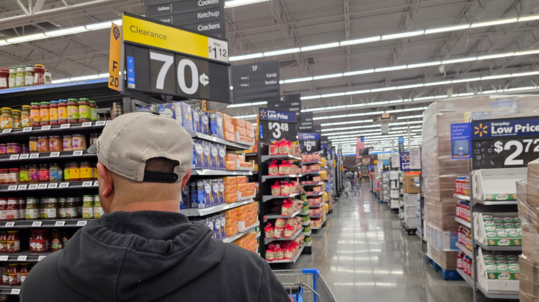Man pushing shopping cart in Walmart