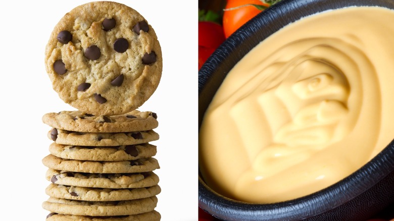 stack of chocolate chip cookies pictured next to a bowl of cheese dip