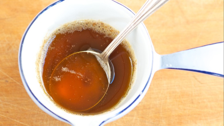 Browned butter in a dish with a spoon