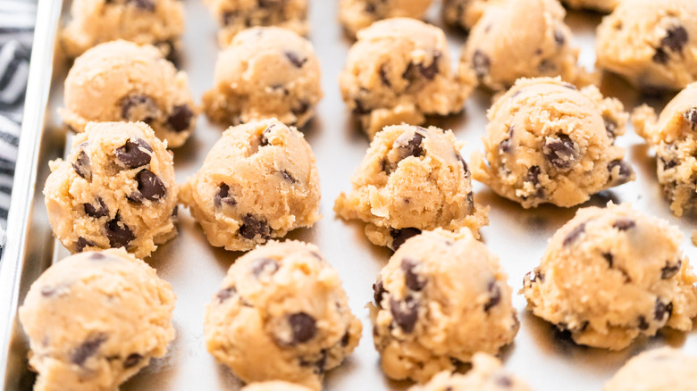 Tray filled with scoops of frozen chocolate chip cookie dough