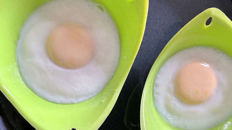 two eggs in silicone poaching trays