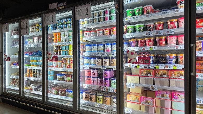 A frozen dairy case in a grocery store