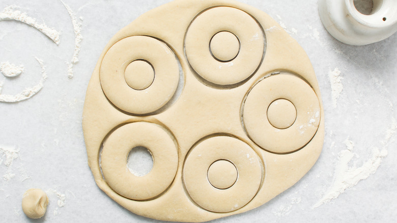 doughnut dough cut out in circles