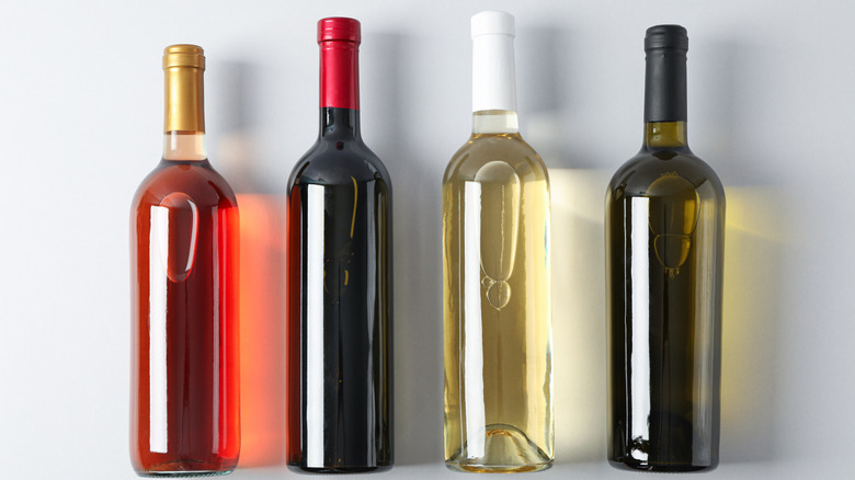 Four unlabeled bottles of wine