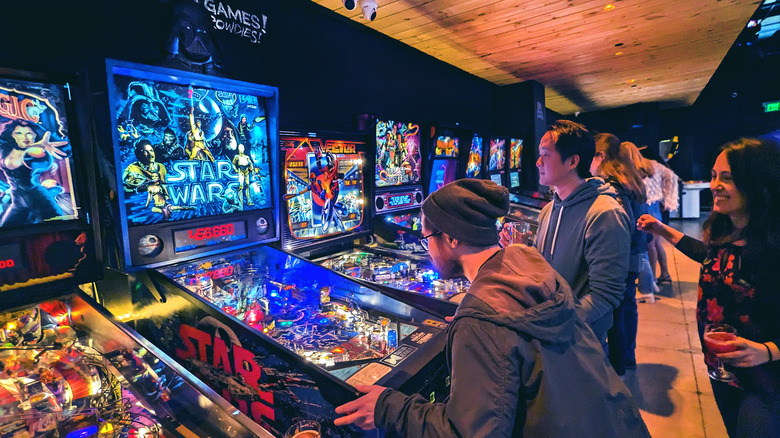 Members of the Philadelphia community playing arcade games together