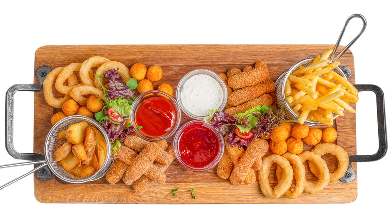 Platter of various fried foods and dressings