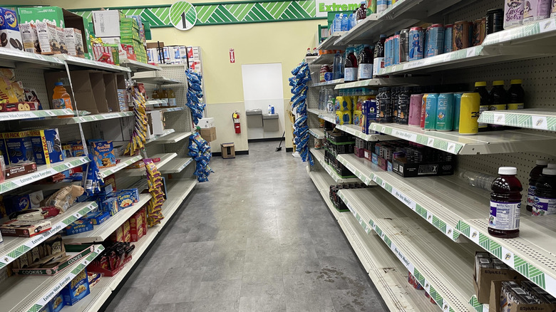 Messy, partially empty shelves in a Dollar Tree
