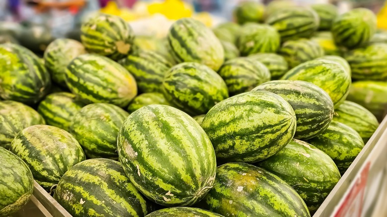 A crate of whole watermelons