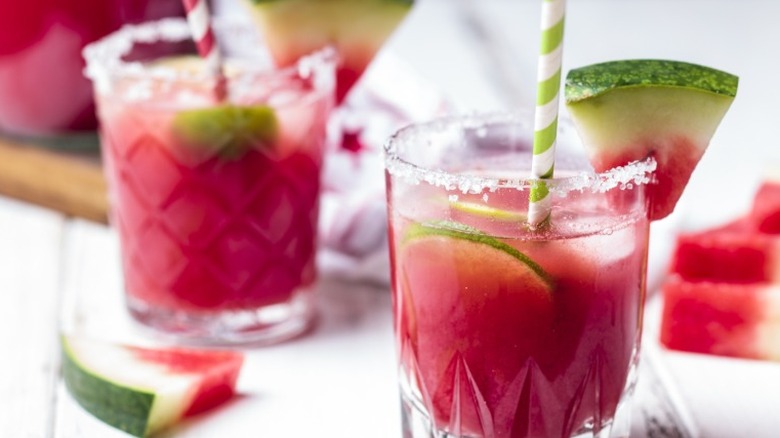 Two watermelon cocktails on white background.