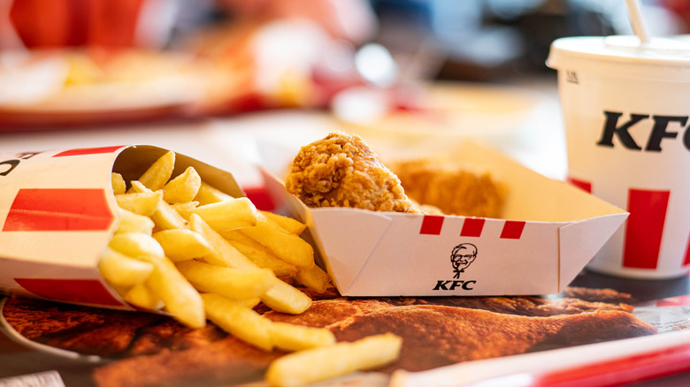 A KFC combo meal with chicken, a drink, and fries