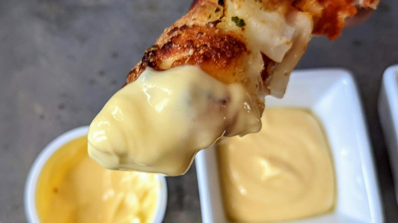 pizza crust dipped in garlic sauce