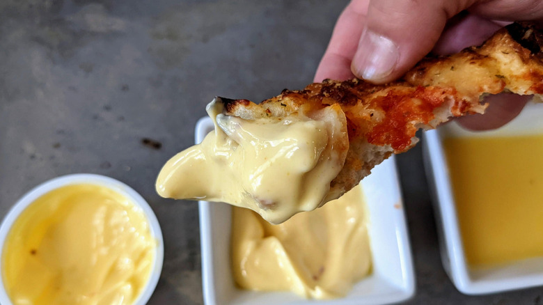 pizza crust dipped in garlic sauce