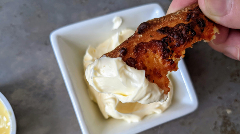 pizza crust dipped in garlic sauce