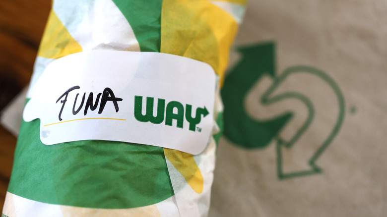 Close-up of a wrapped Subway tuna sandwich