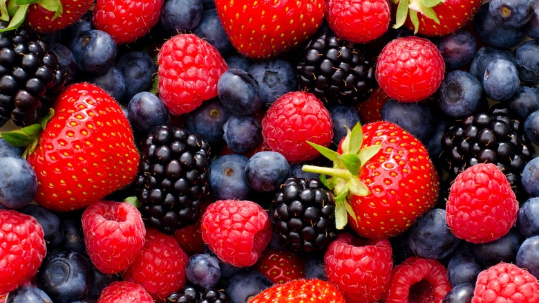 Close up of loose strawberries, blueberries, blackberries, and raspberries