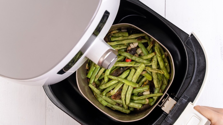 Green beans in air fryer top down view
