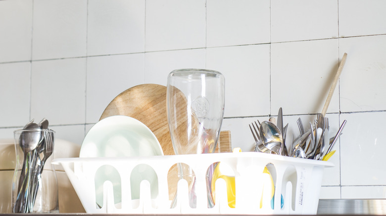 A dring rack in a clean kitchen.