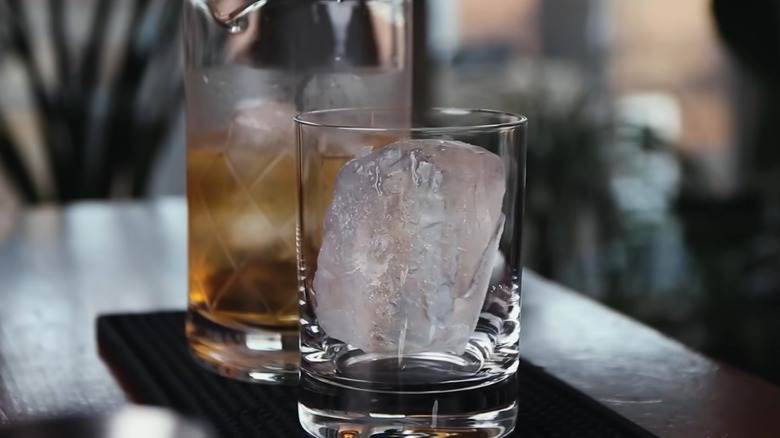 A double rocks glass filled with ice