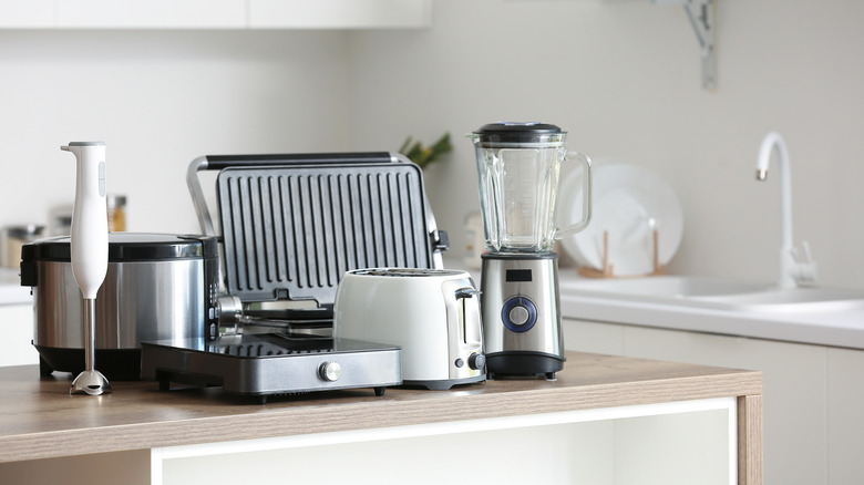 A collection of appliances on a kitchen counter.