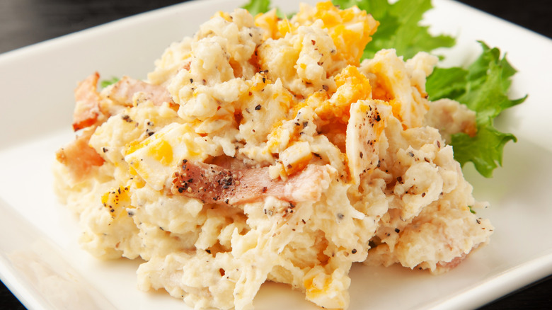 Creamy potato salad with bacon and cheese