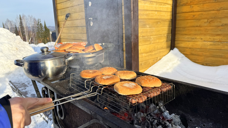 buns being grilled over charcoal