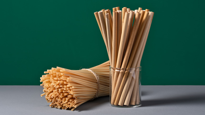 Bamboo straws on a dark background.