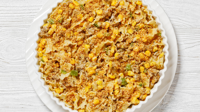 creamed corn casserole with sausage, noodles, and breadcrumbs
