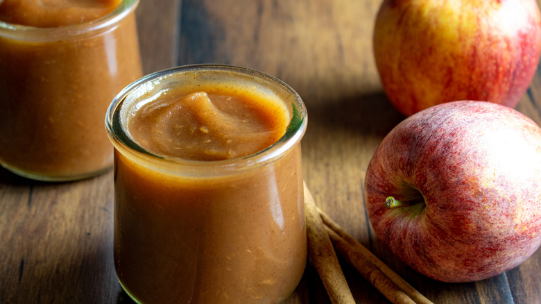 Two small glass cups of homemade apple butter