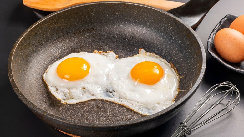 Two fried eggs in a skillet