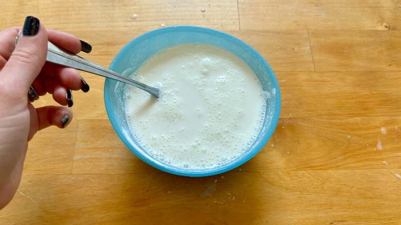 Thick milk in bowl